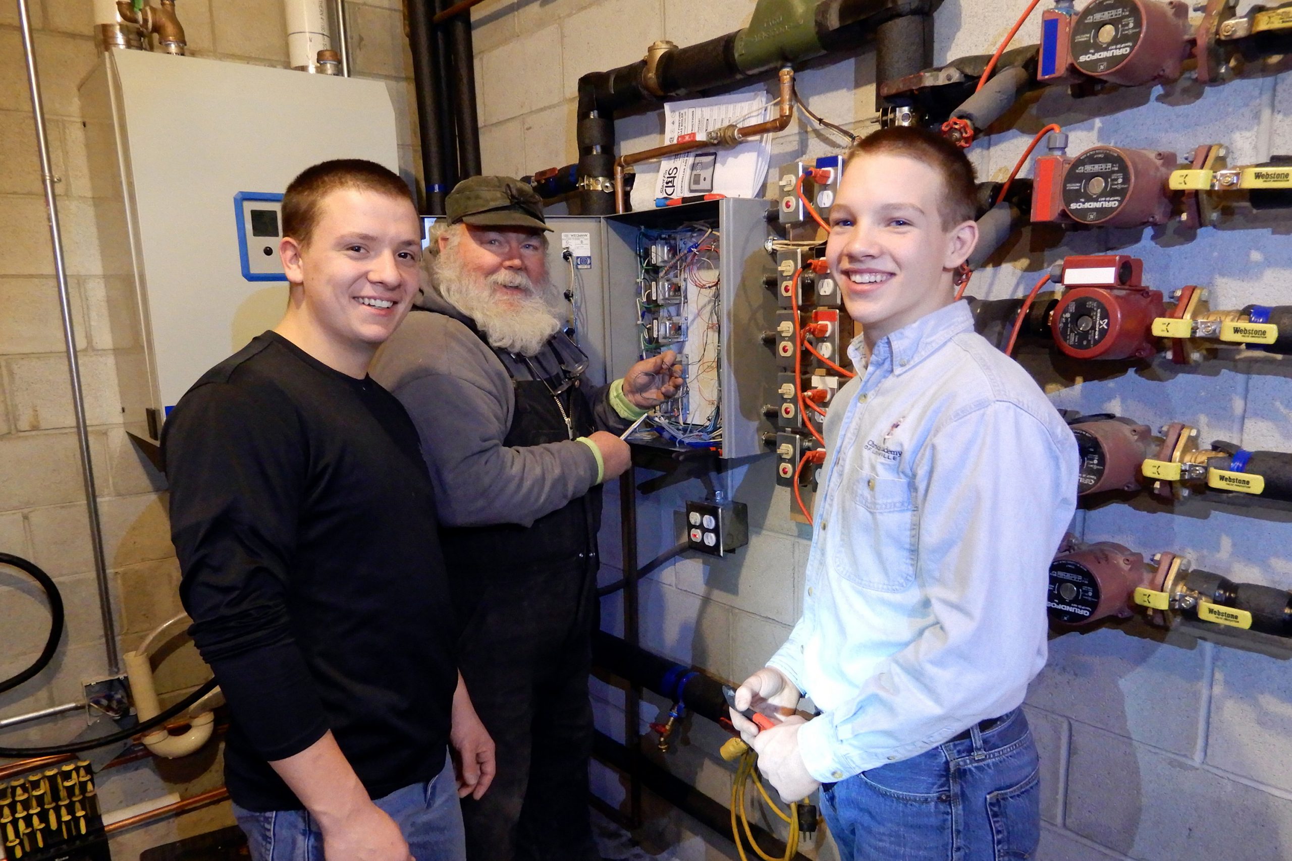 Pinehaven man with boys at electrical panel